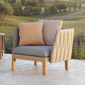 Exceptional Royal Botania Calypso lounge chair with light beige quilted textile upholstery and stainless steel base