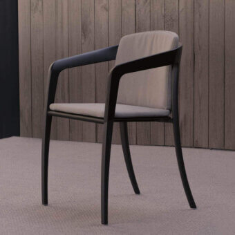 Elegant Royal Botania Jive armchair with woven olefin seat, tapered aluminum structure and light gray cushions crafted with teak armrests